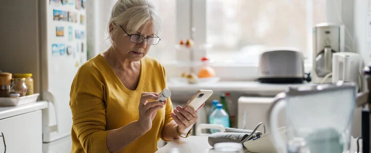 Older woman checking cell phone